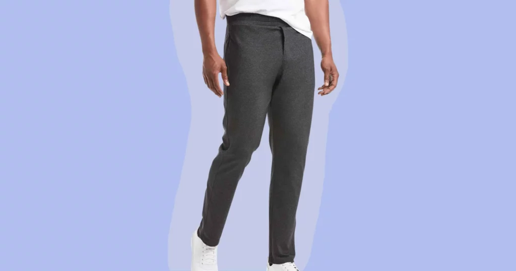 man wearing public rec pants in dark gray with white shoes