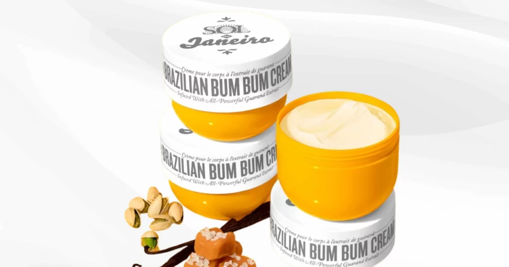 3 orange jars of Brazillian bum bum cream, 2 stacked together and 1 with the lid off