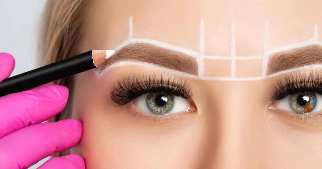 close up of woman's eyes with a diagram of brow mapping over eyebrows in white pencil