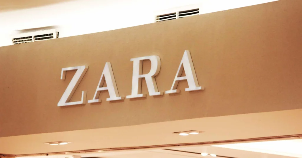close up of a zara sign in white letters outside the store