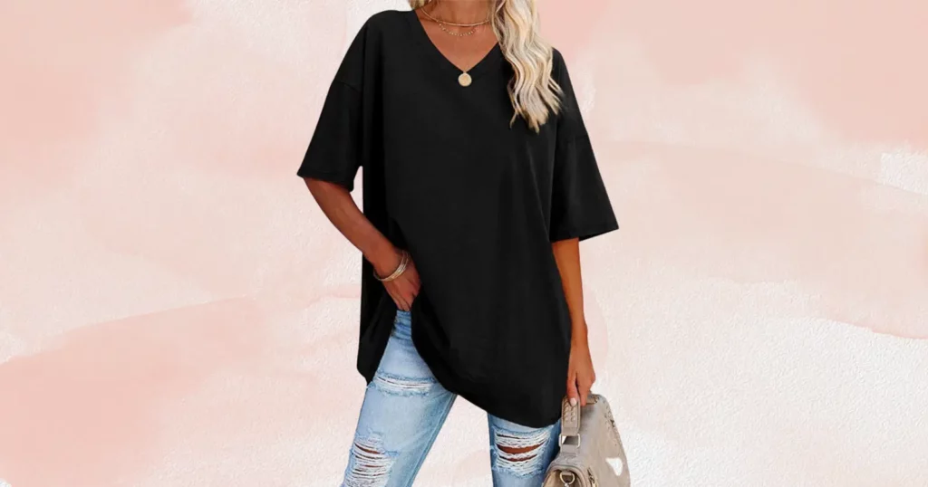woman wearing oversized black shirt and ripped jeans from Fashionmia
