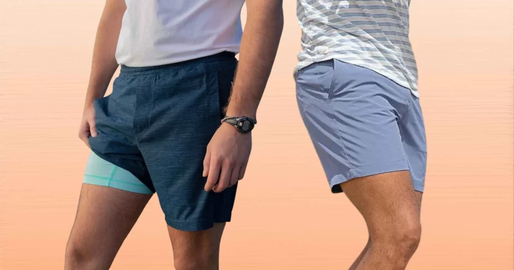 close up body shot of man wearing blue Birddogs shorts and a man wearing light gray Chubbies shorts