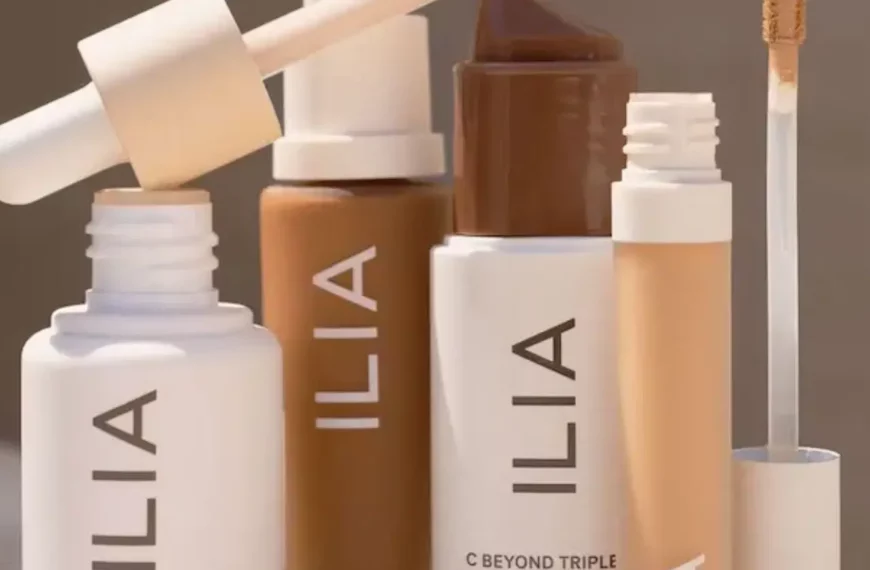 bottles of white and nude-colored bottle of Ilia Beauty products