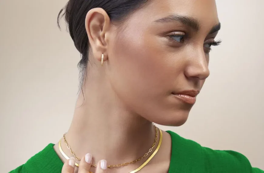 close-up of woman wearing necklaces and earrings from Mint and Lily