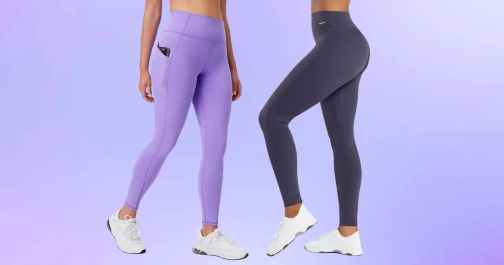 closeup of two people's lower half, one wearing purple Fabletics leggings and white shoes, the other wearing gray Gymshark leggings and white shoes