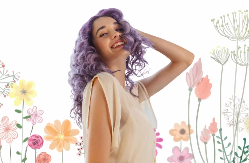 woman smiling, looking at camera with hand on head, she has purple hair from aura hair care products