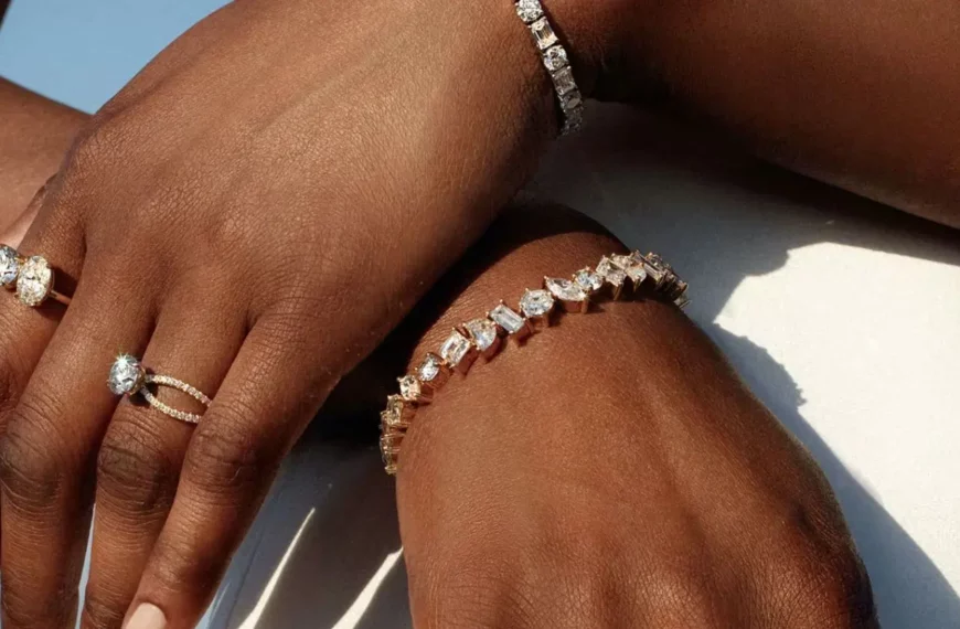 closeup of person's hands wearing diamond rings and bracelets from Vrai