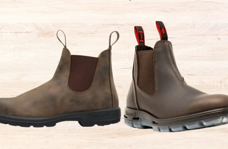 one brown Blundstone boot facing left, one brown Redback boot facing right