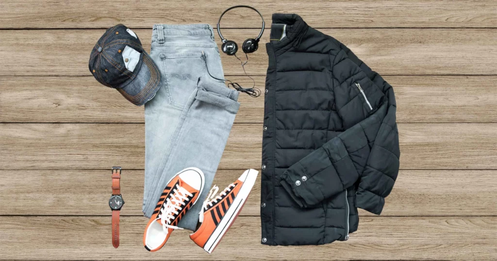 men's clothing pieces including denim hat, jeans, orange shoes, and black jacket