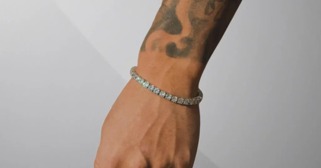 close up of person's wrist with tattoos, wearing tennis bracelet from Cernucci