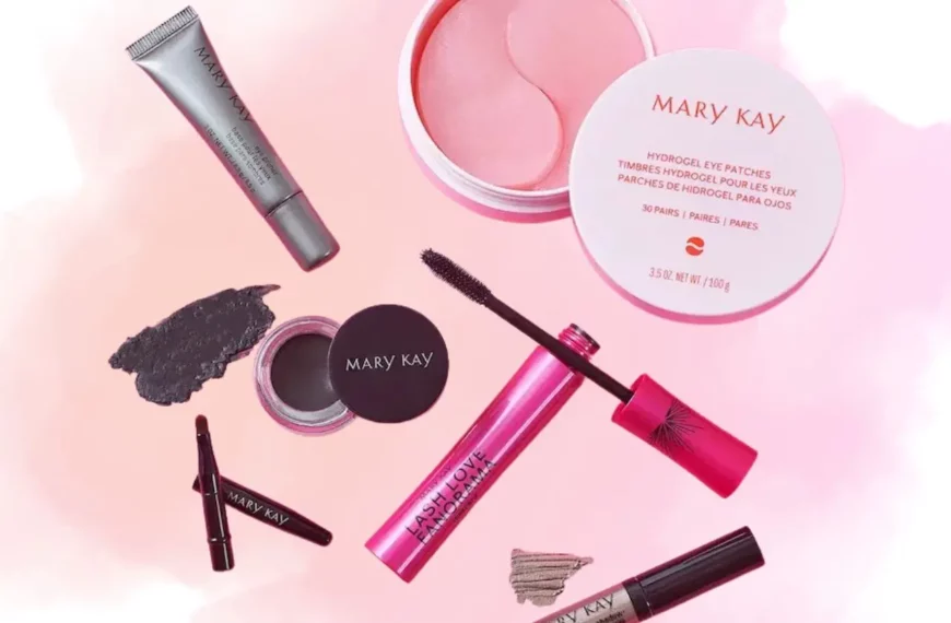 assortment of Mary Kay beauty products against white and pink background
